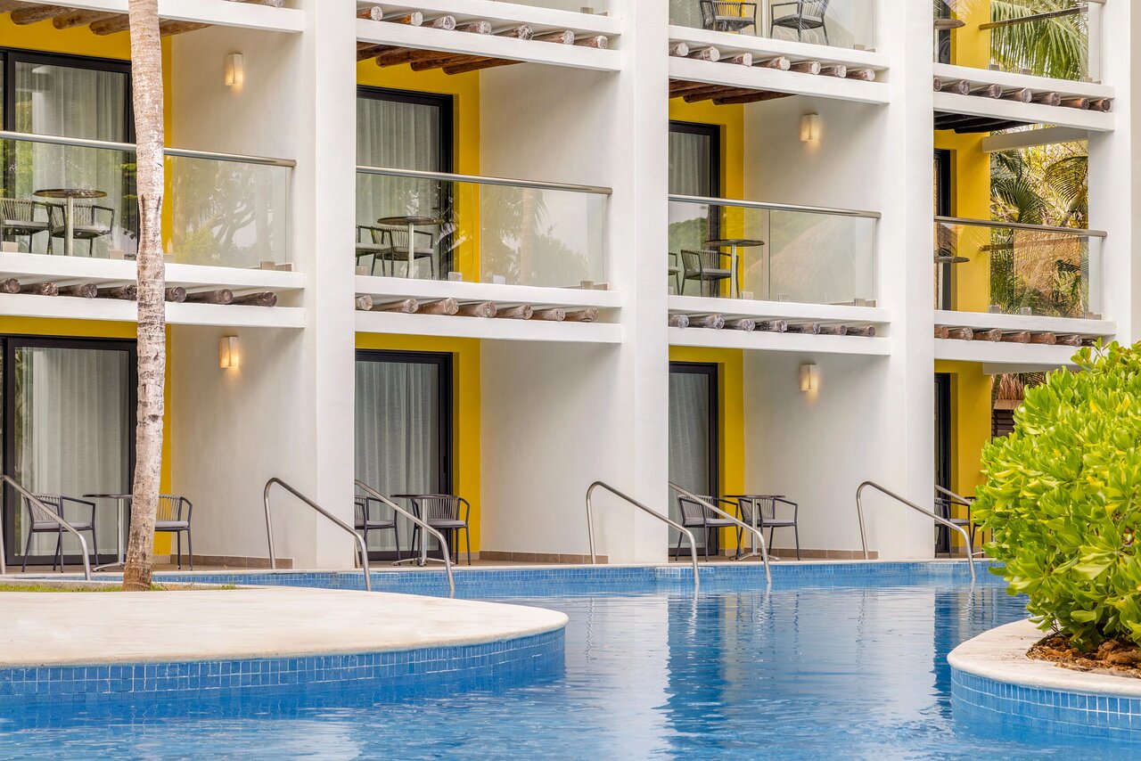 Junior Suite Swim-Up Pool View building at Secrets Aura Cozumel