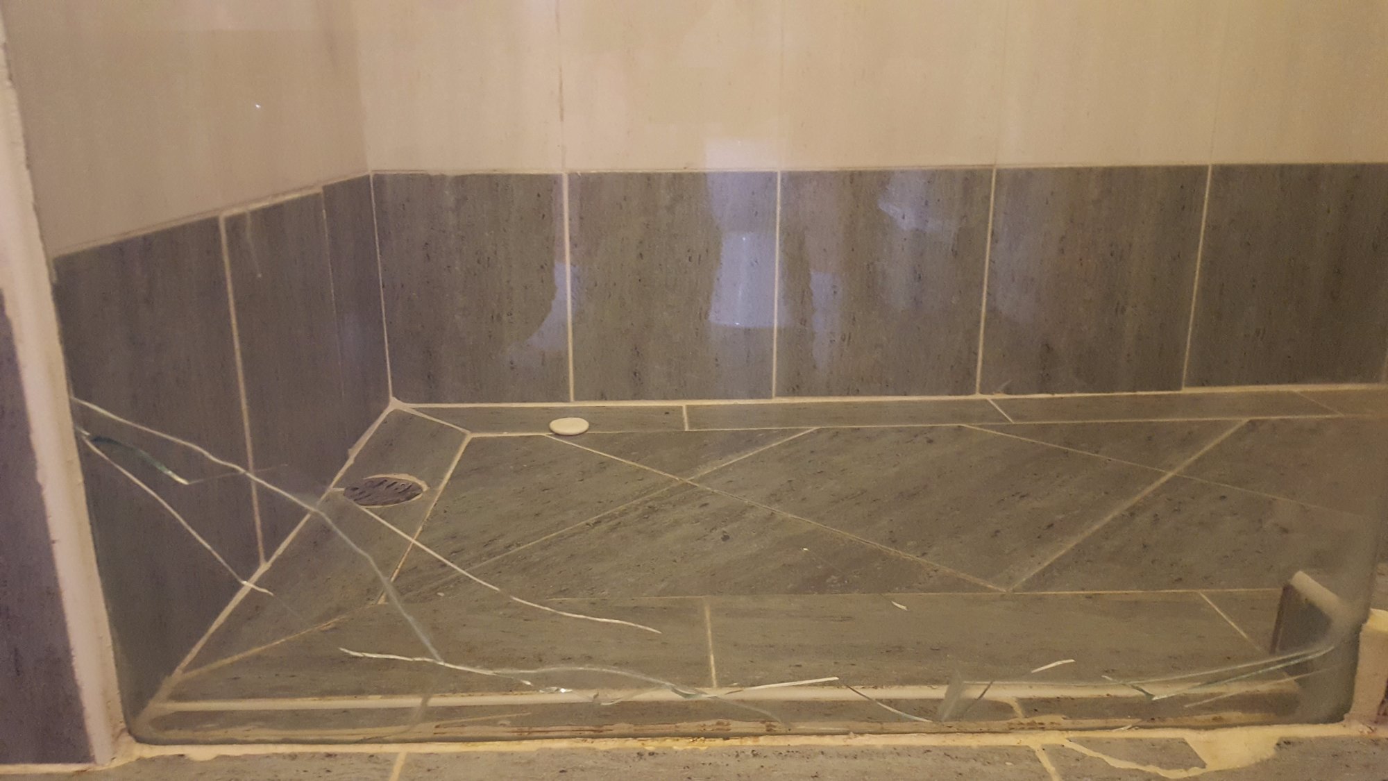 Broken shower glass